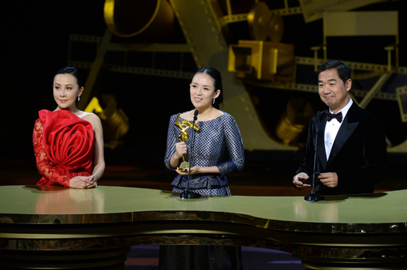 Zhang Ziyi receives the Best Actress Award for her performance in The Grandmaster from celebrity juror Carina Lau and Zhang Guoli